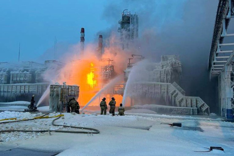 Rescuers working to extinguish a fire at a natural gas terminal in the Russian Baltic Sea port of Ust-Luga on Jan. 21, 2024.