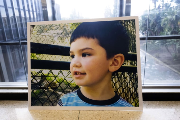 A photo of Aiden Leos leans against the courthouse wall after prosecutors spoke to the media in Santa Ana, Calif., on January 25, 2024.