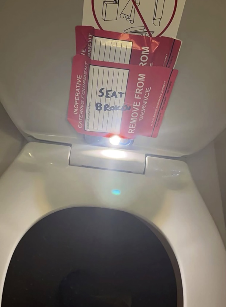 An iPhone is taped to the back of a toilet seat on an American Airlines flight from Charlotte, N.C., to Boston, Sept. 2, 2023.