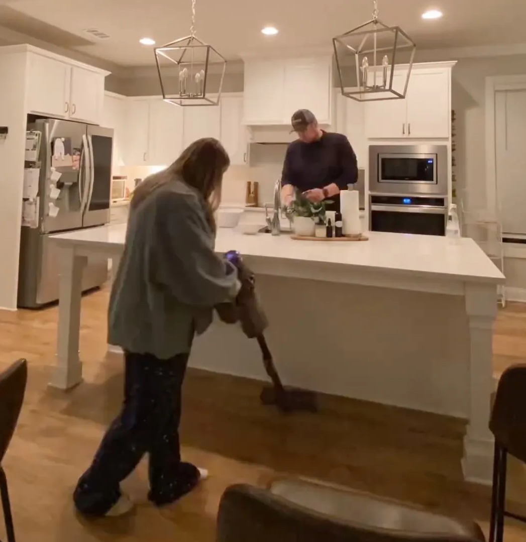 The couple carry out a closing checklist in their kitchen every night before going to bed